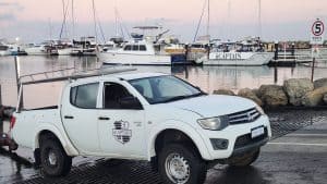 iiCAPTAIN Vehicle with iiCAPTAIN branded boat in the background